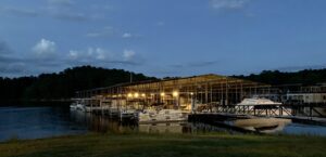 Boat storage Lincolnton, GA at Plum Branch Yacht Club marina with covered slips on Lake Thurmond at dusk